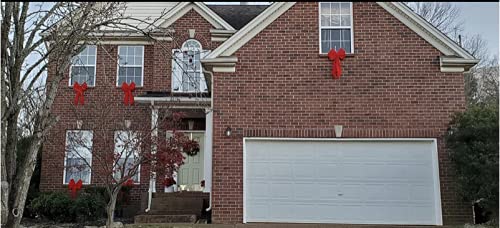 Red Bow's on exterior of house Christmas decor