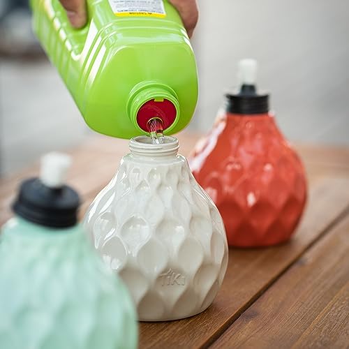 TIKI Brand 3-Pack Seaside Table Torch, 6 Inch being filled