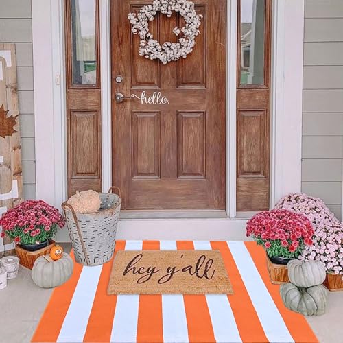 Orange and white striped entryway rug