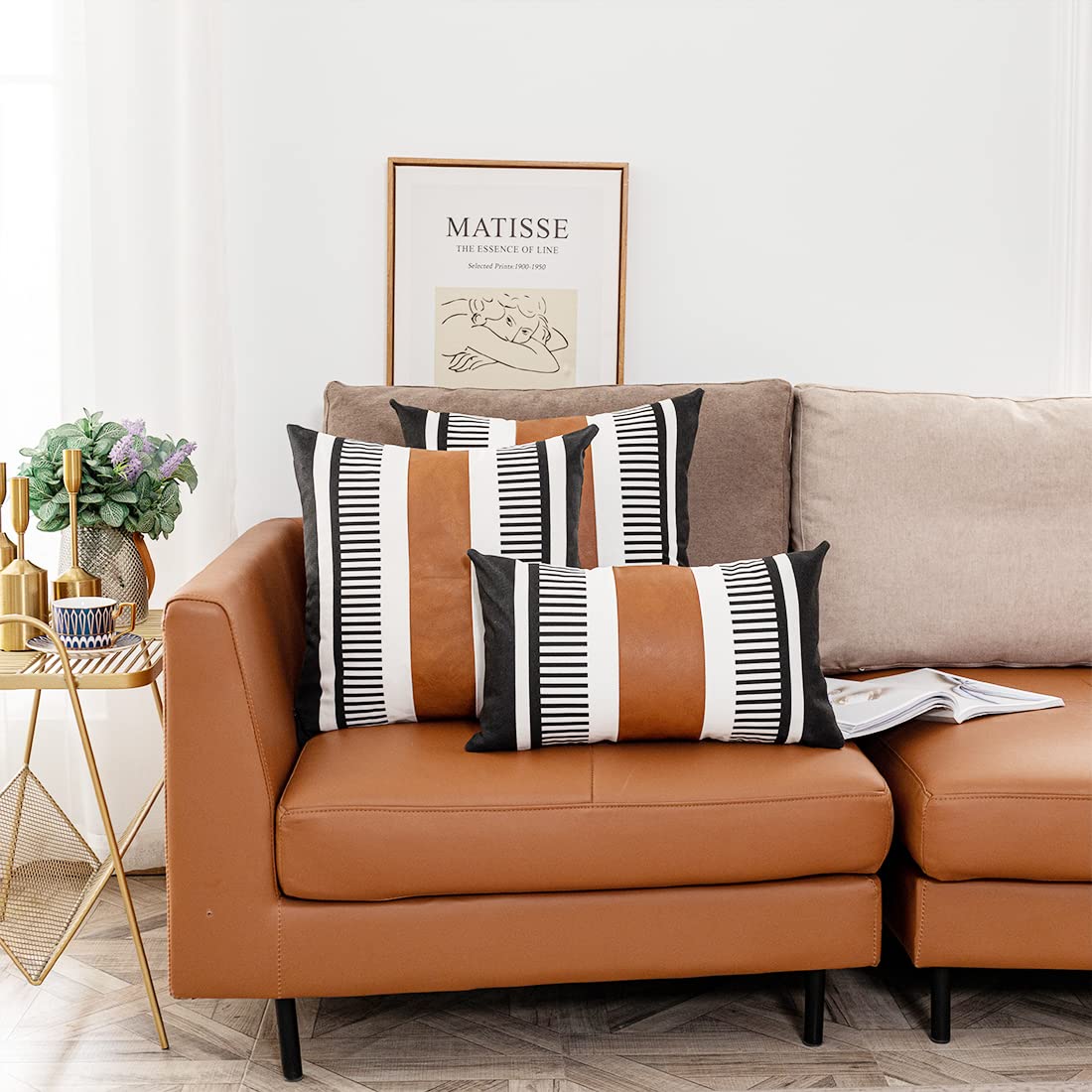 Pillow Covers with black and white striped pattern with faux leather accent on couch