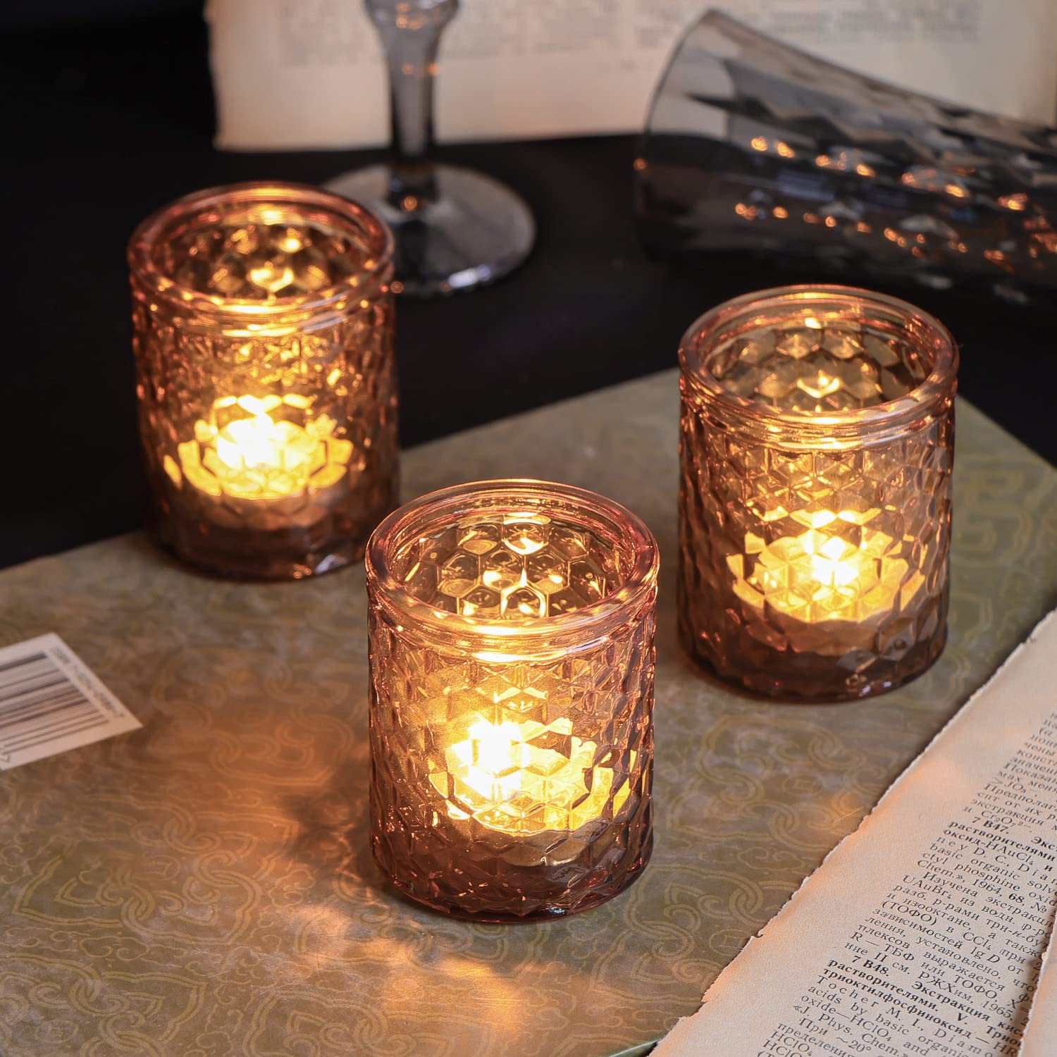 lit candles in glass holders decor