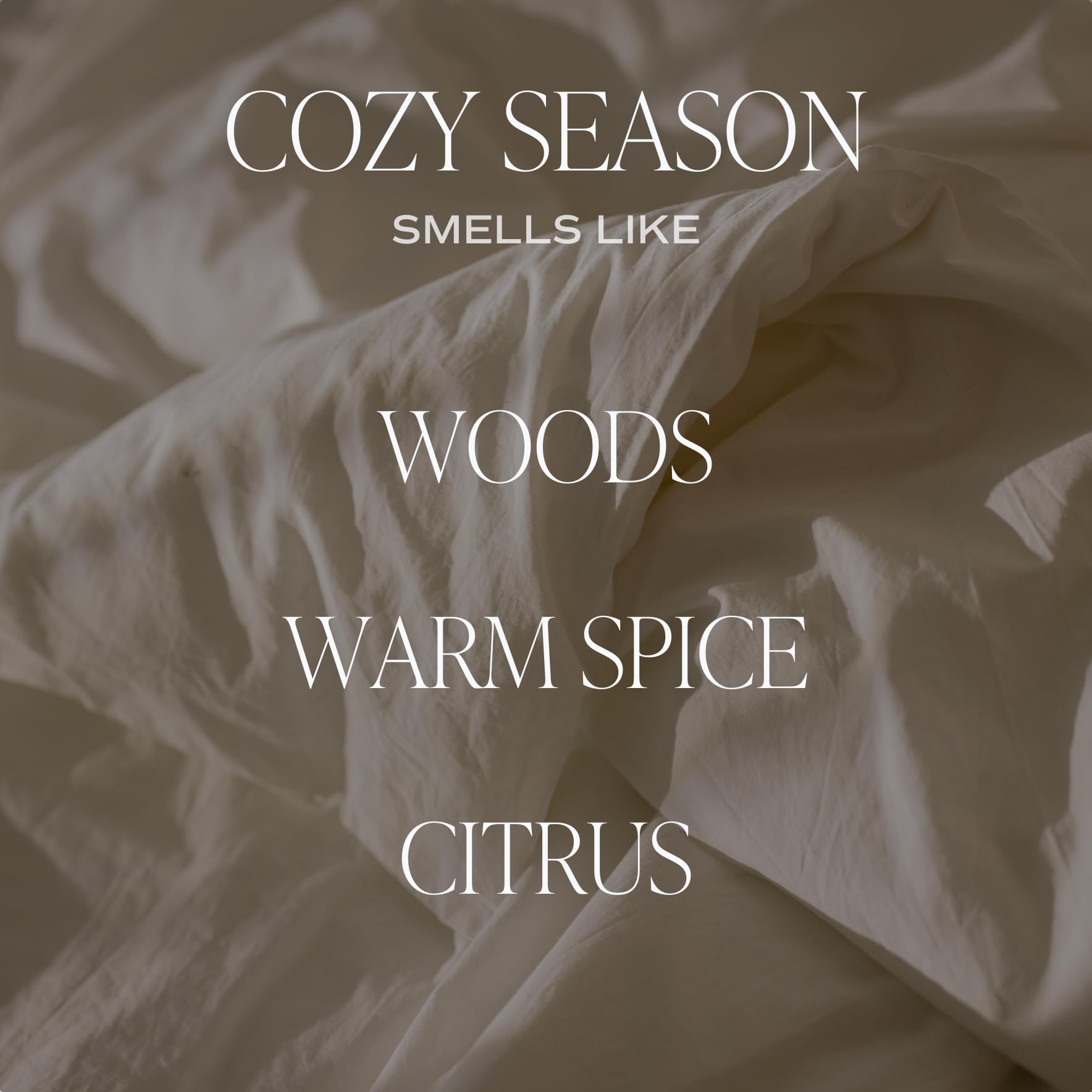 Cozy season candle scent includes notes of wood, warm spice and citrus