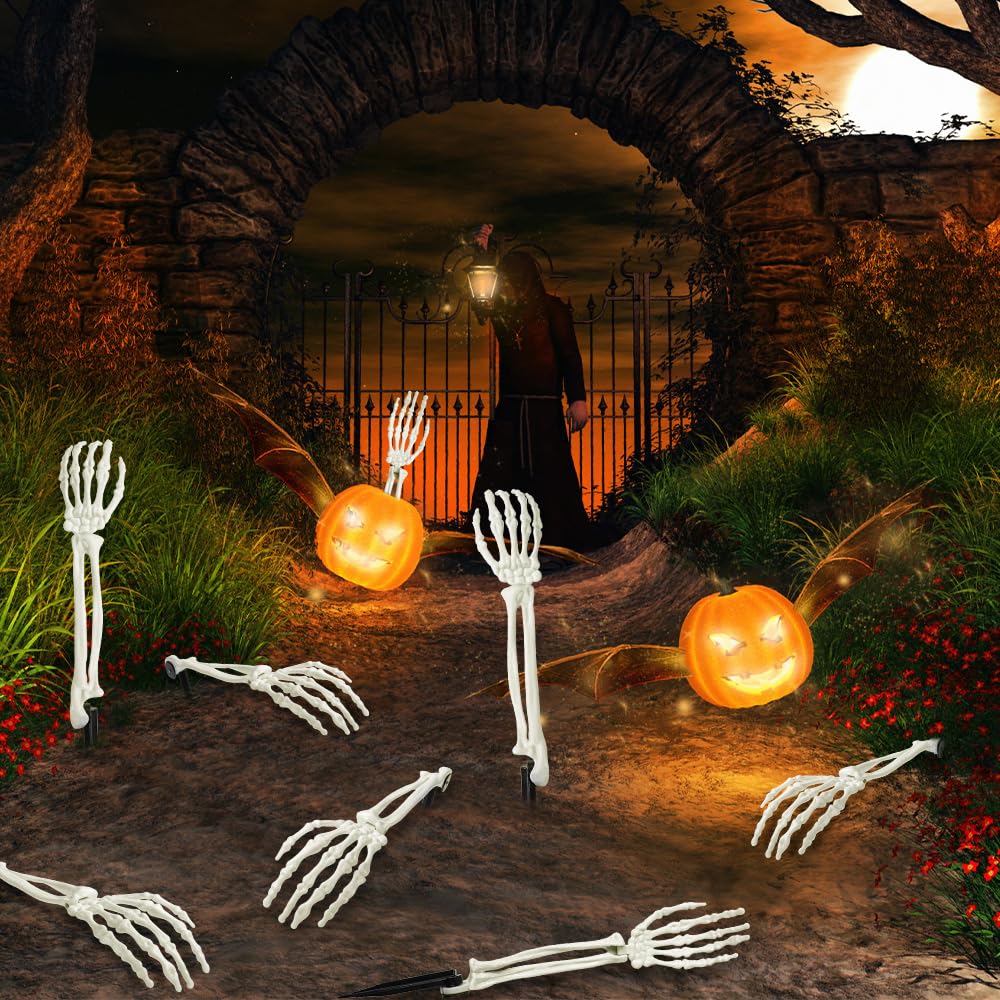 dirt path illuminated pumpkins skeleton stakes