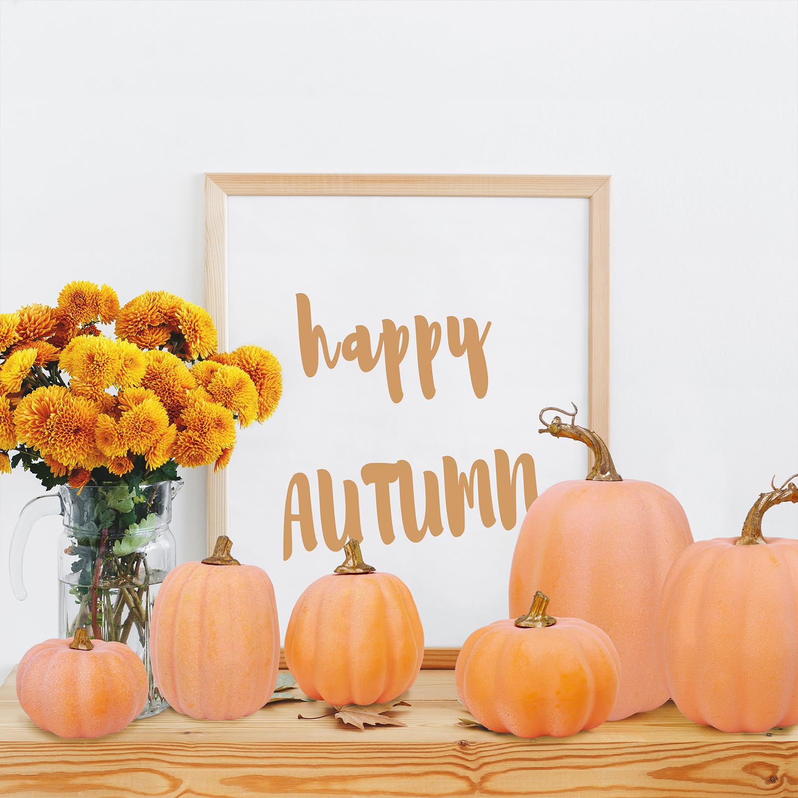 orange pumpkins with gold stems table decor