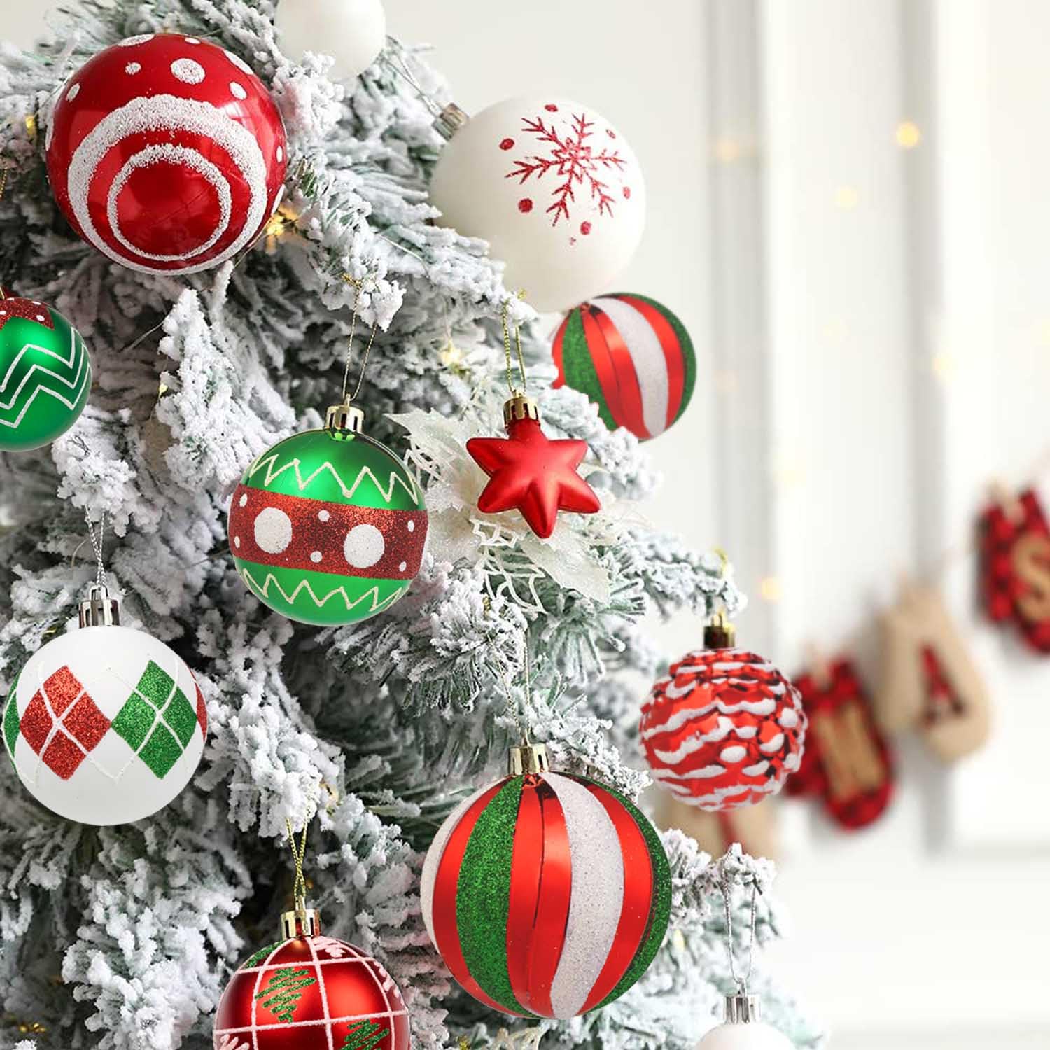 Christmas ornaments on white fake Christmas tree