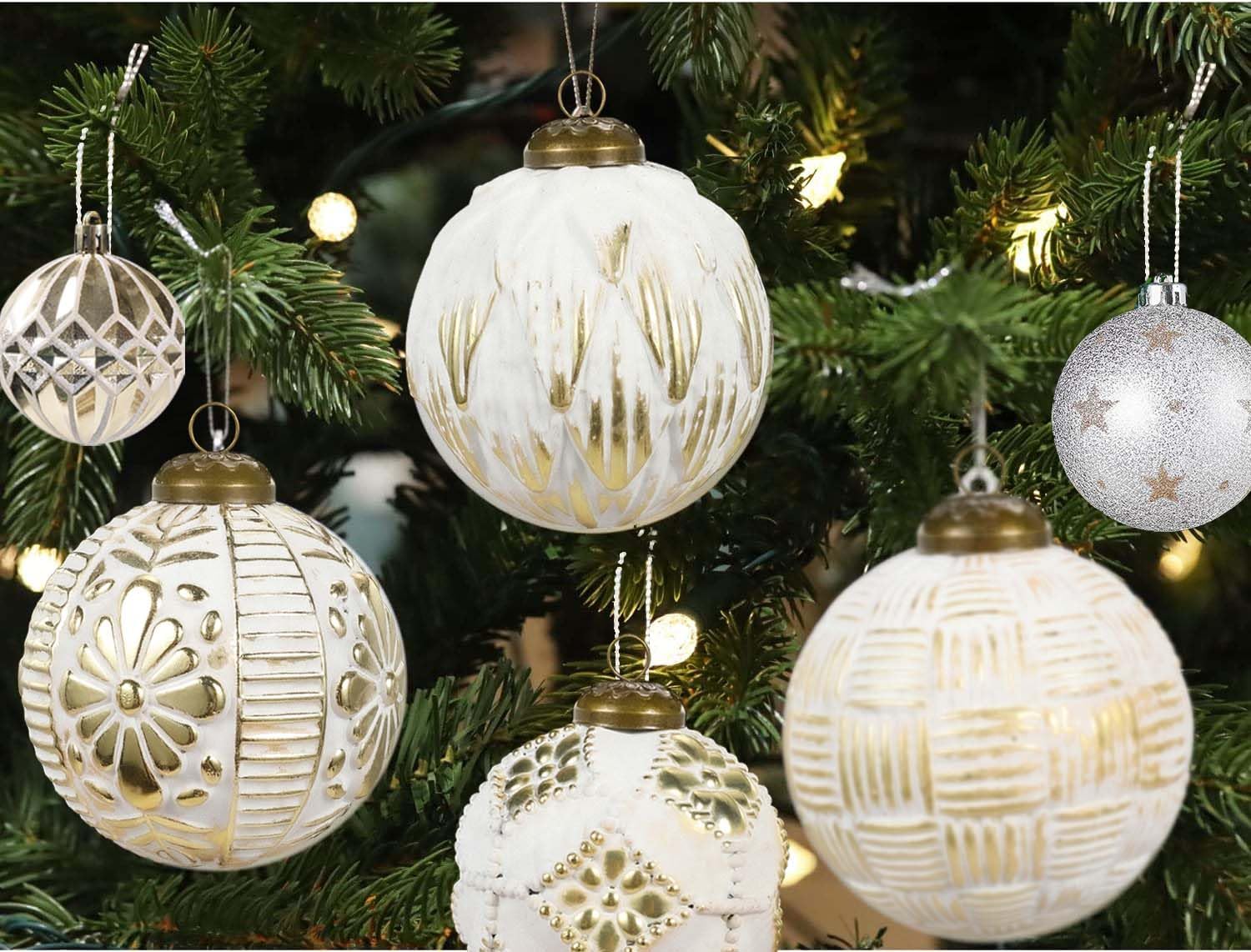 close-up of white and gold Christmas tree decor