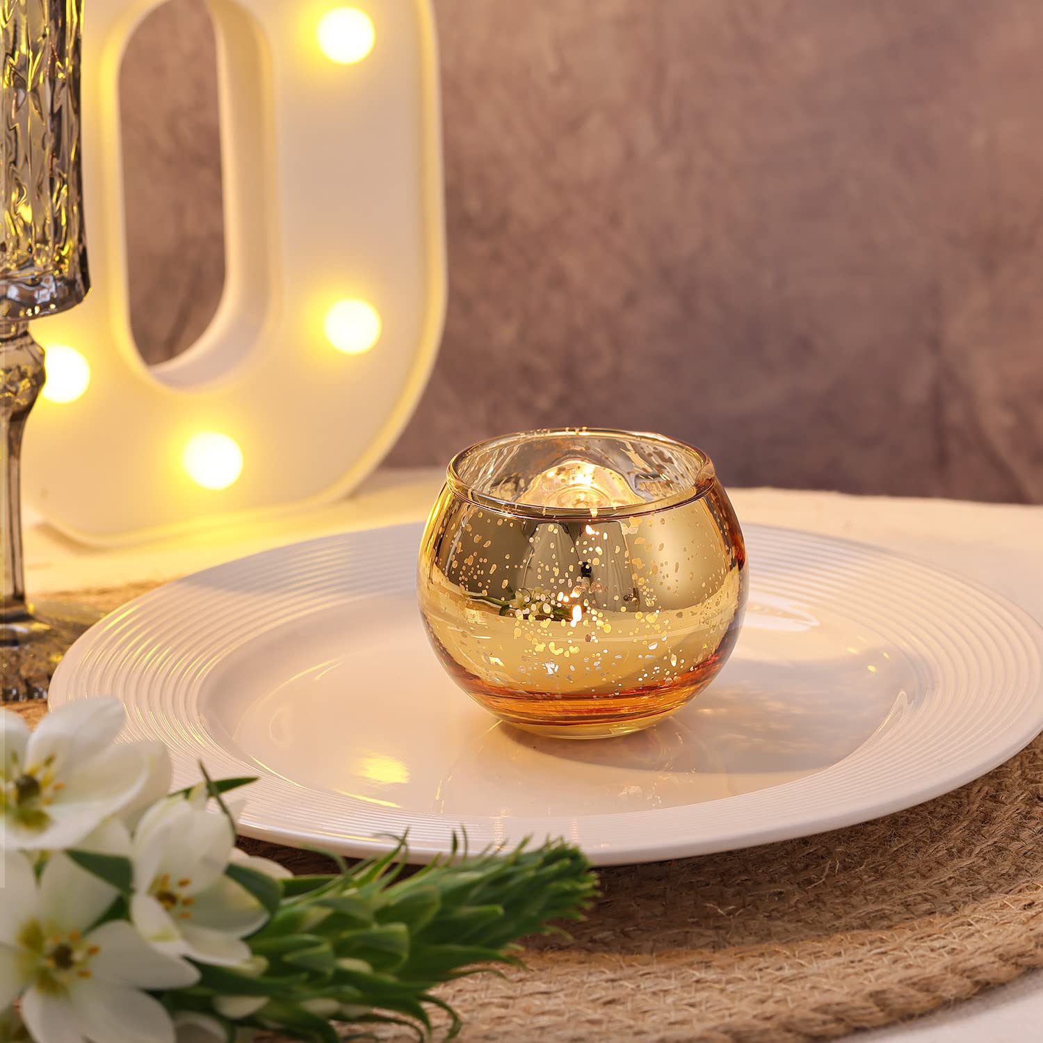 place setting with gold votive candle holder