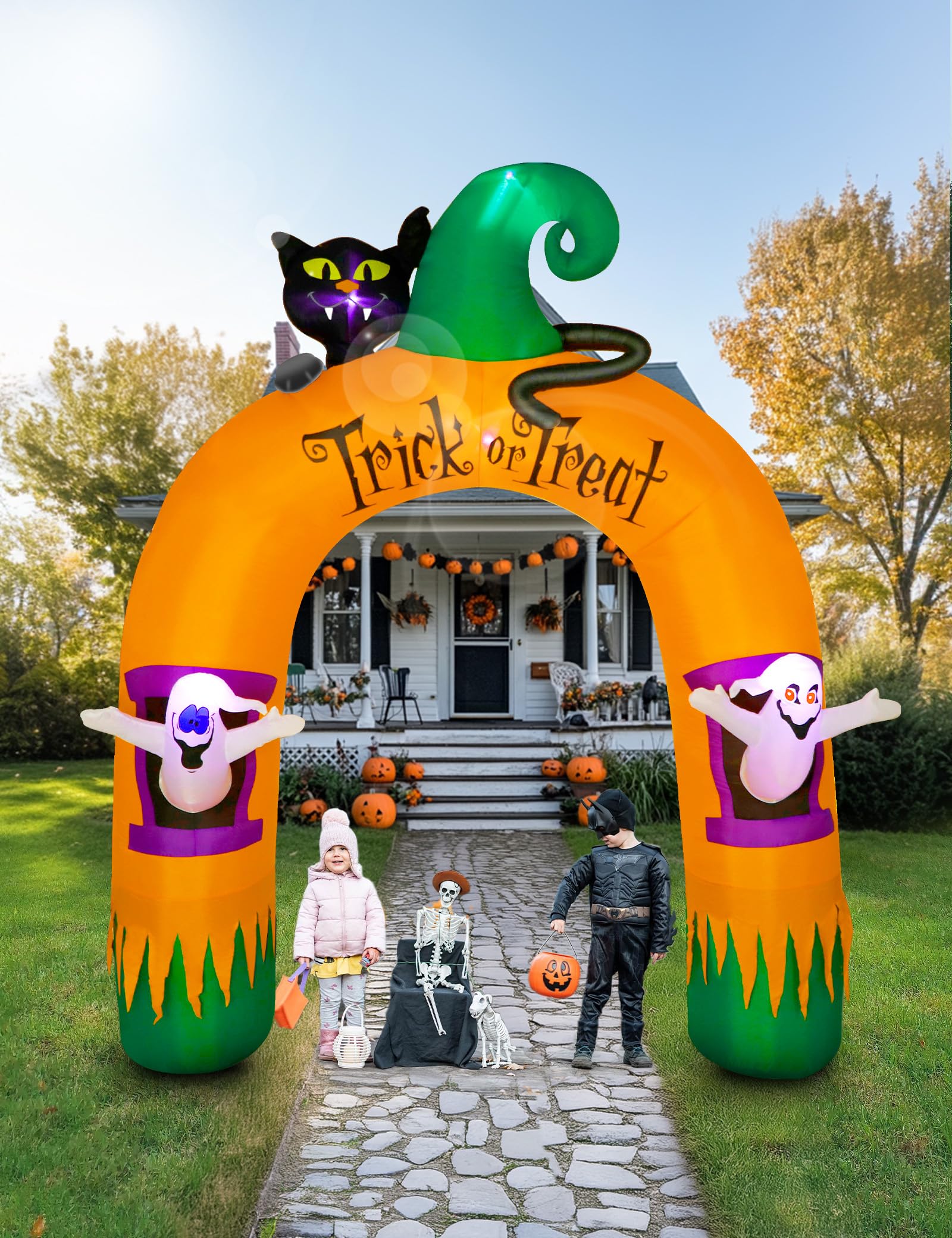 kids in costumes inflatable halloween archway
