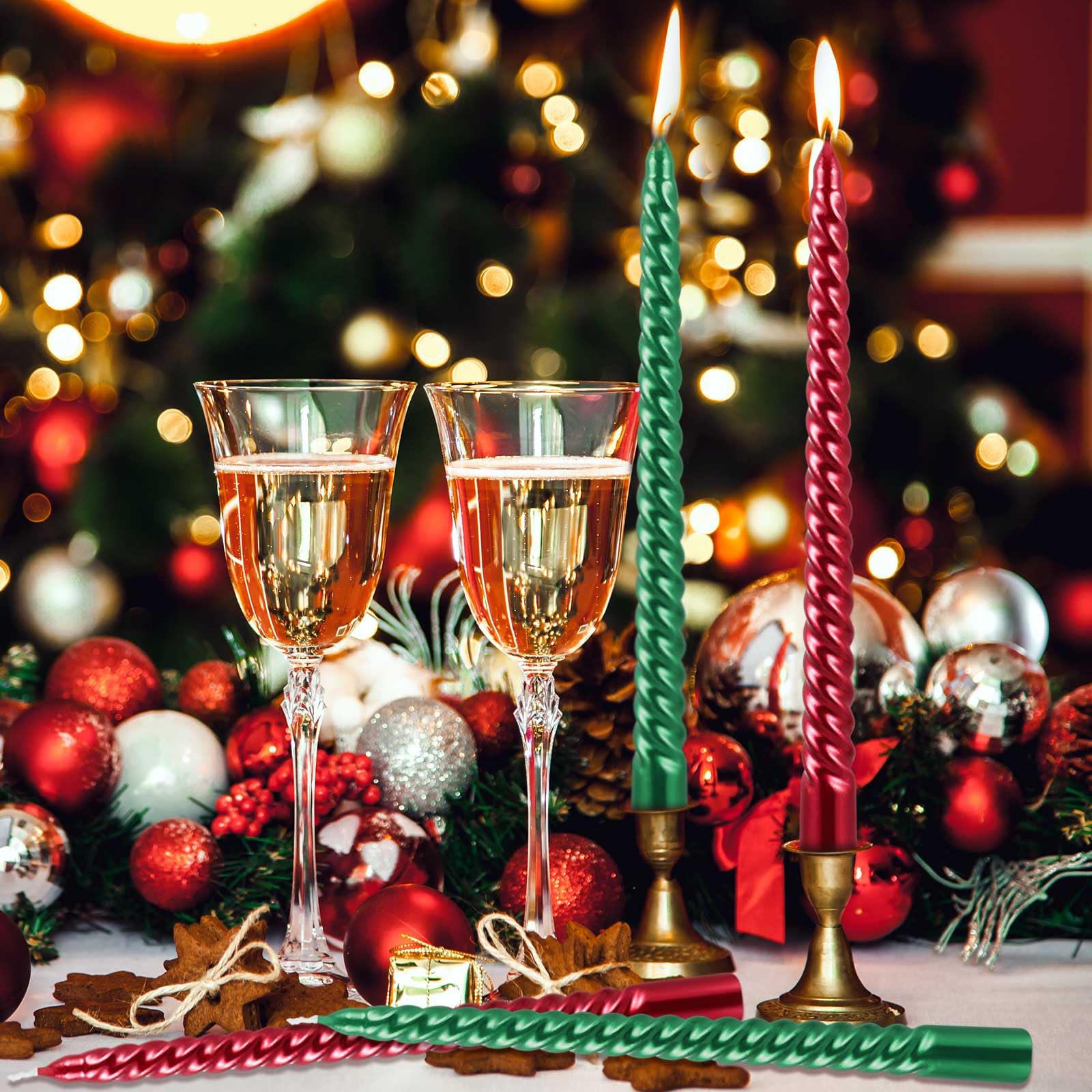 lit candles next to champagne filled glasses