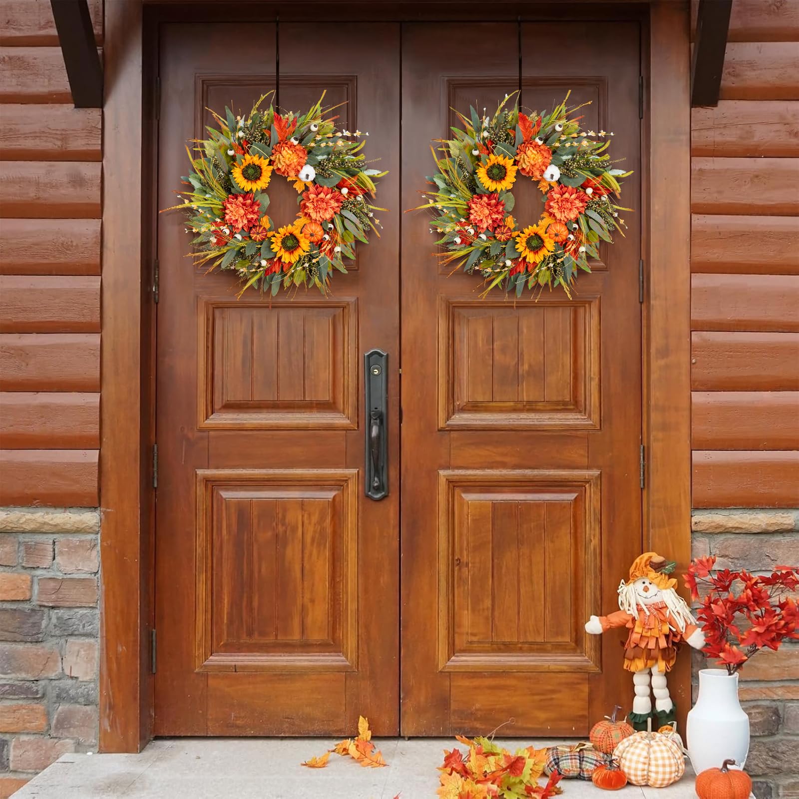Wooden double doors with autumn wreaths and decorations