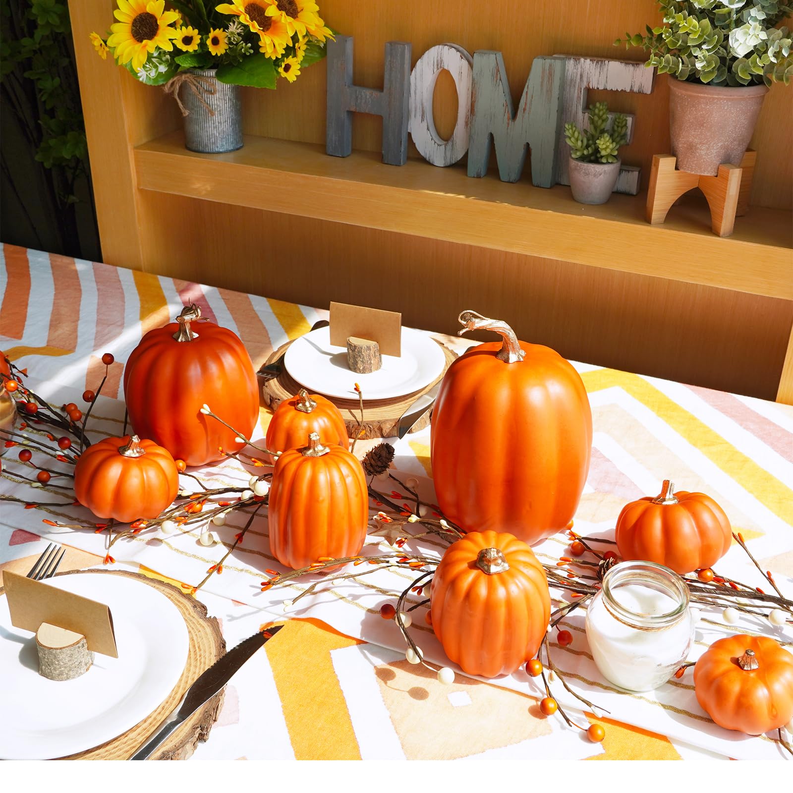 orange fake pumpkin table decor setup