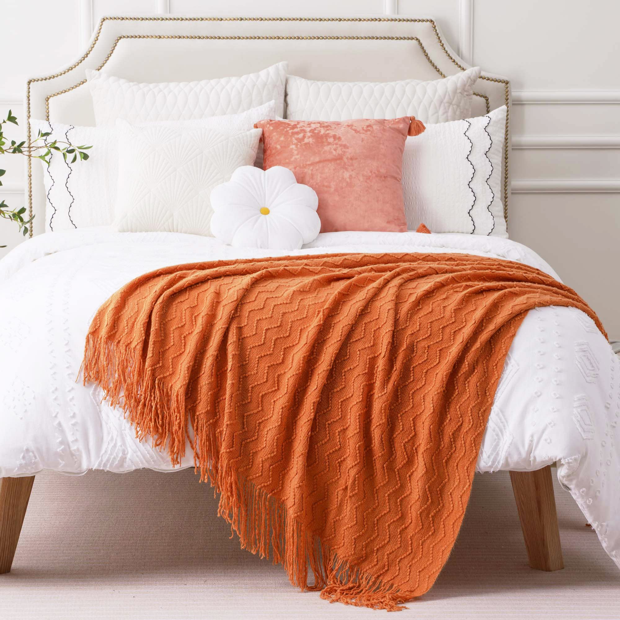 Orange throw blanket with fringe
