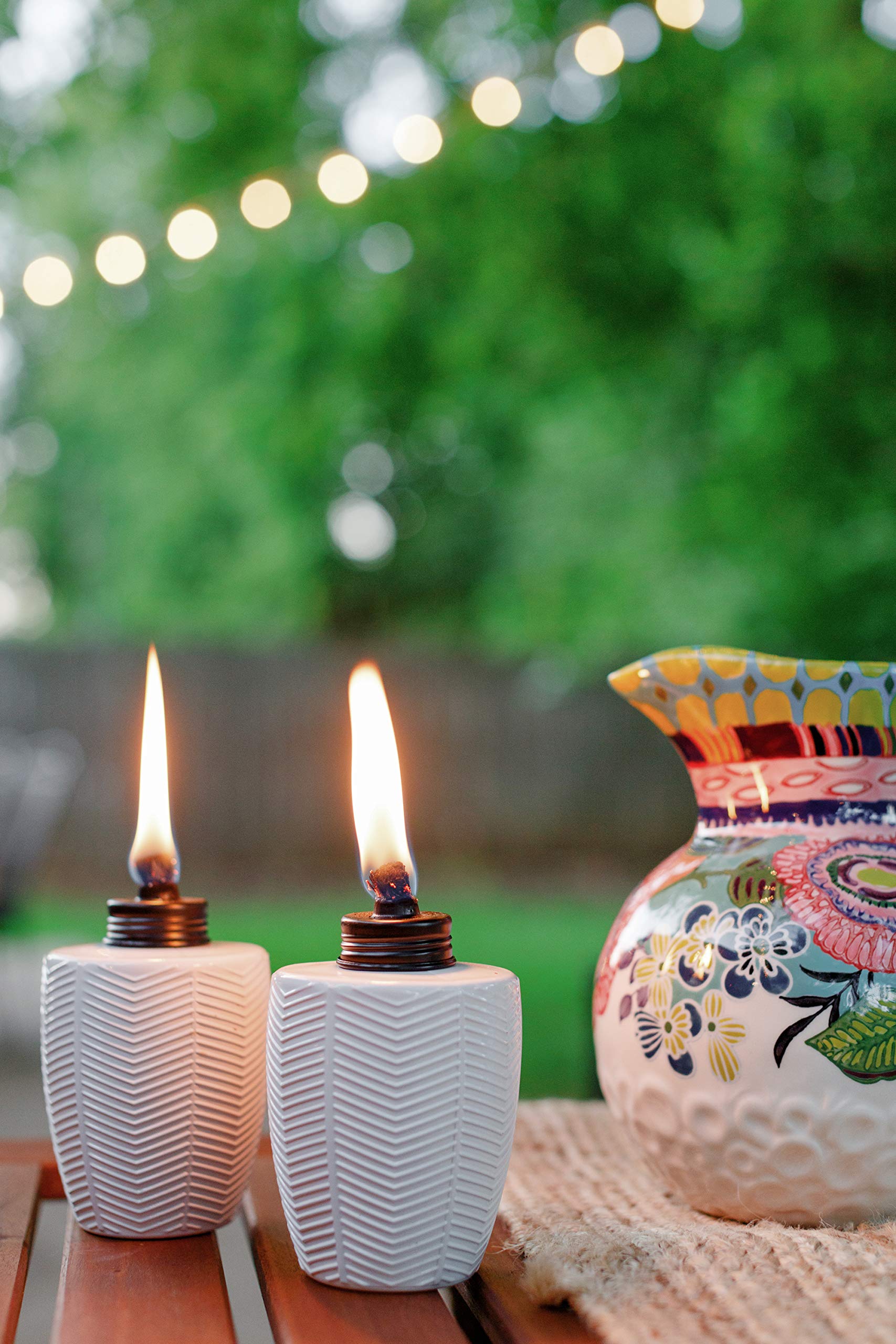 two table torches on outdoor table