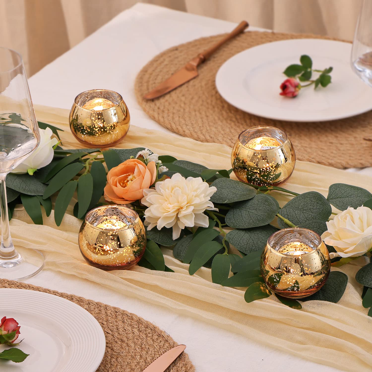 Fake flower table decor with gold candle holders