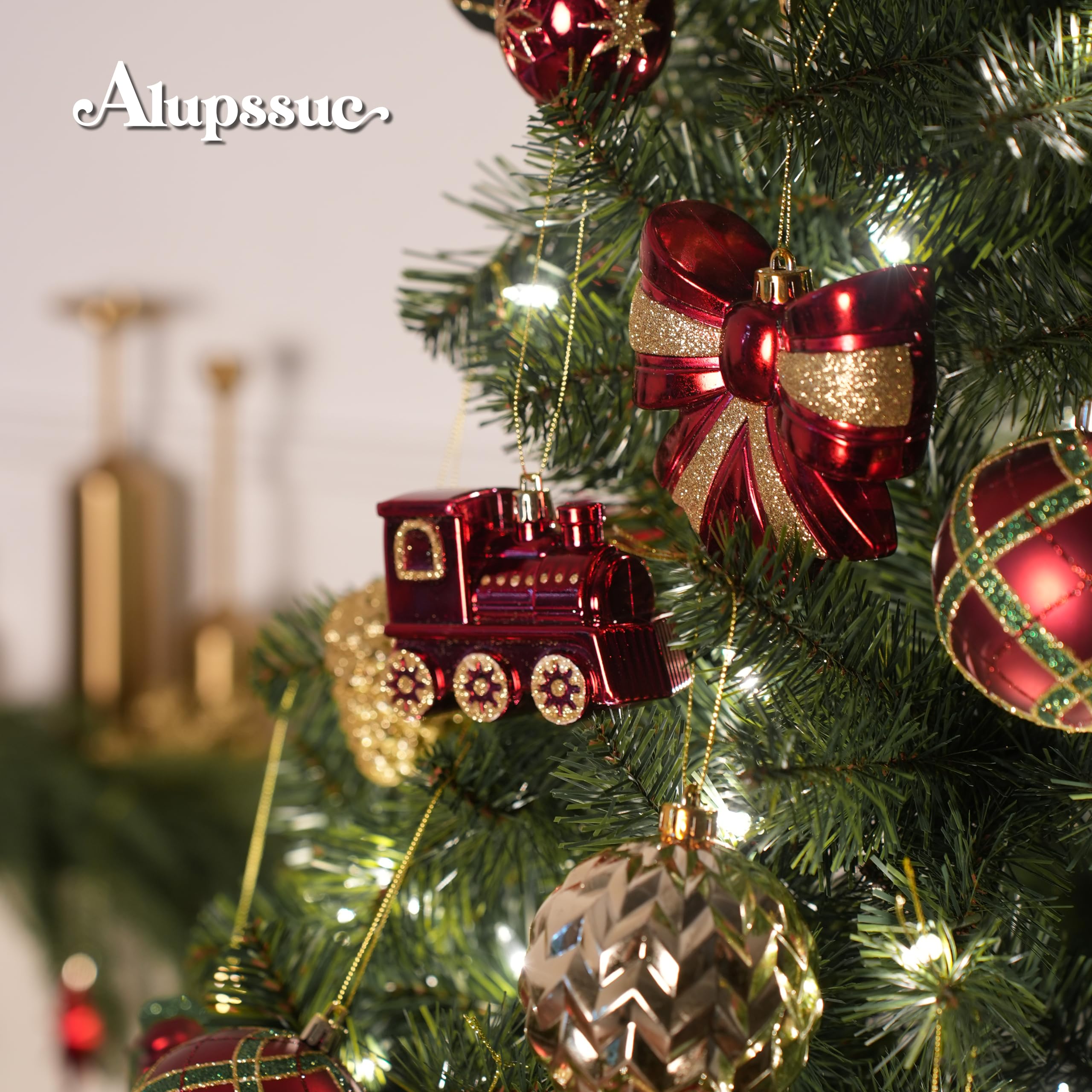 Red green gold ornaments on Christmas tree close up
