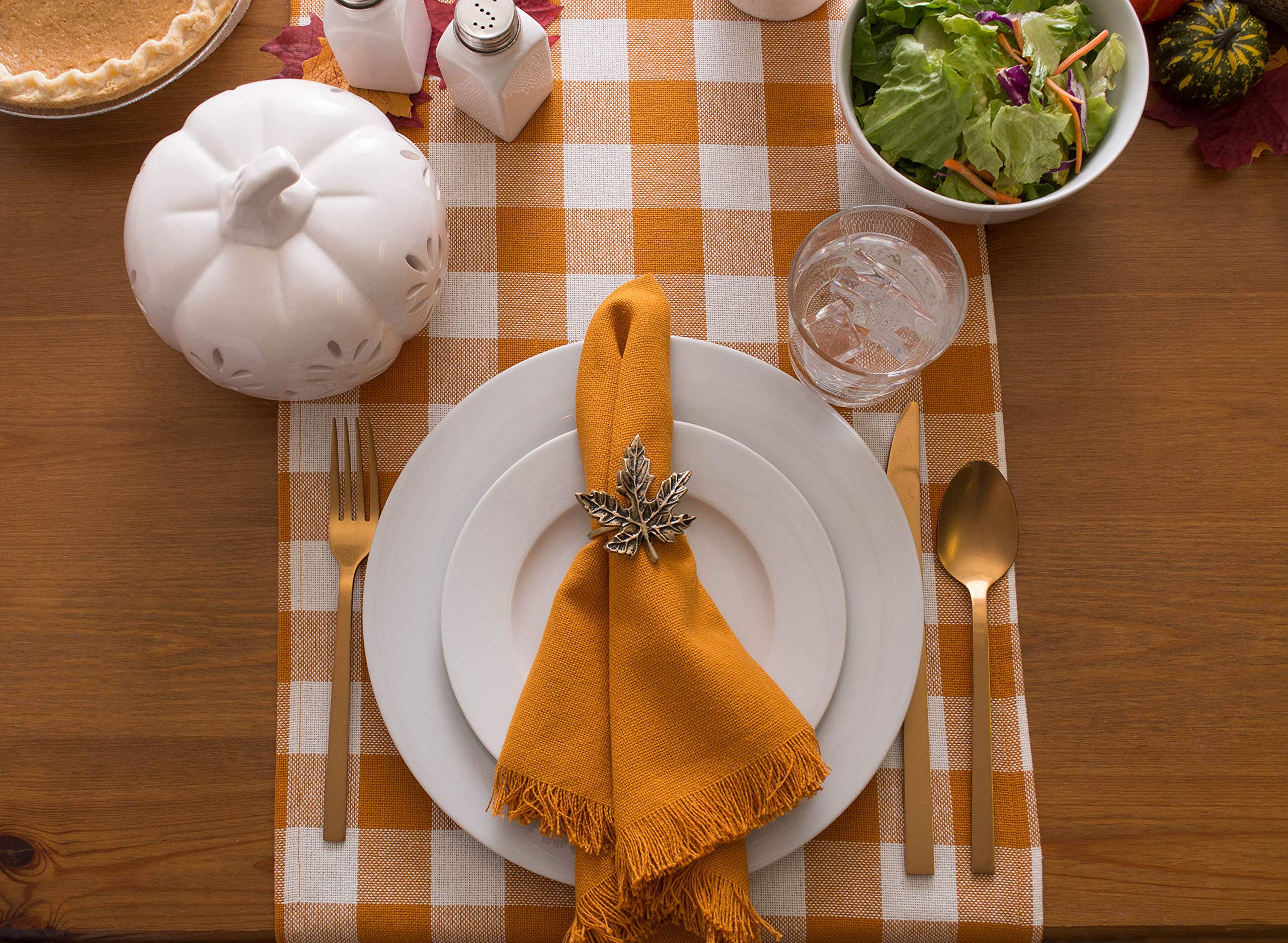 fall table decor idea with checkered orange fall table runner and orange linen napkin