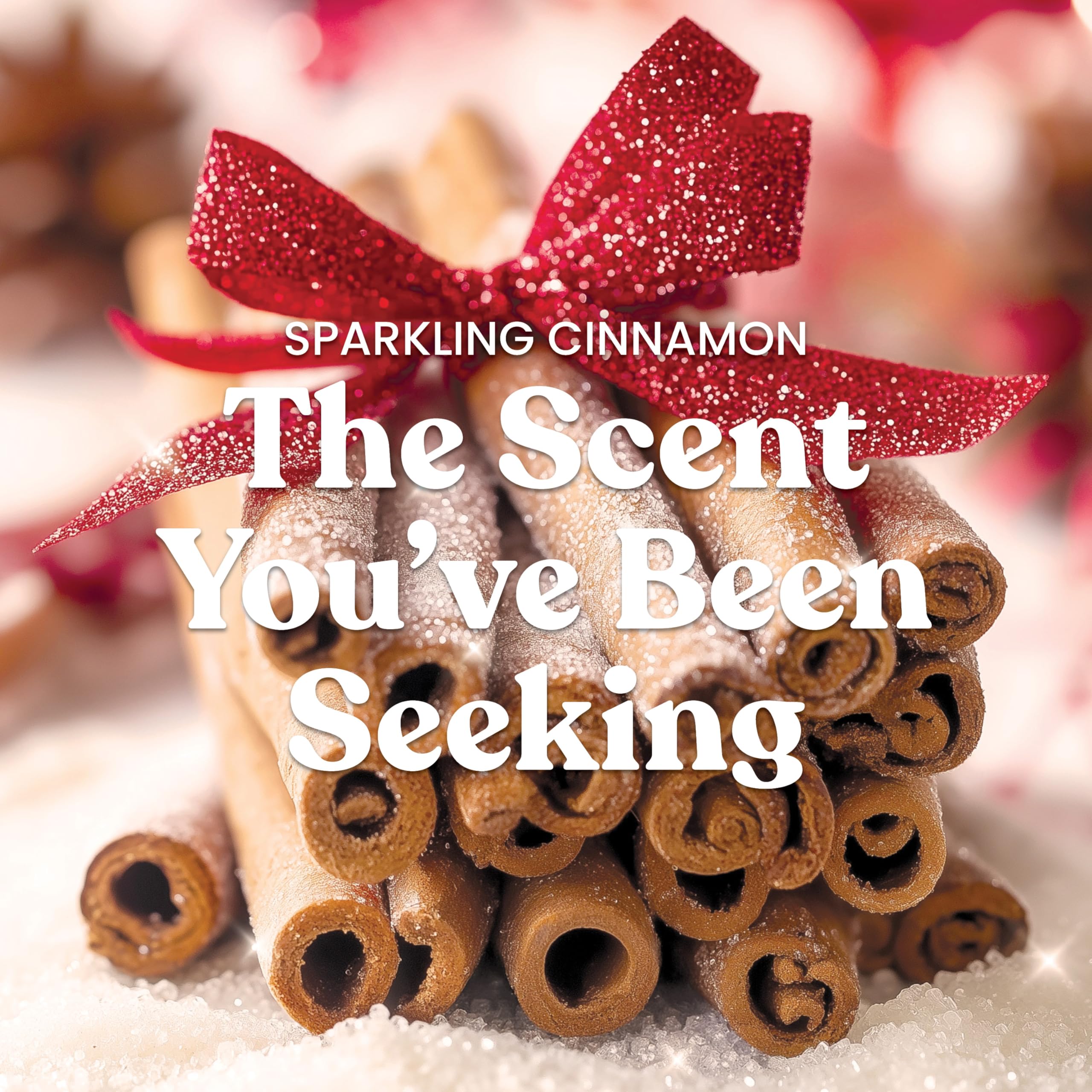 Stack of cinnamon sticks with a red bow on a snowy background, text 'Sparkling Cinnamon: The Scent You've Been Seeking'.