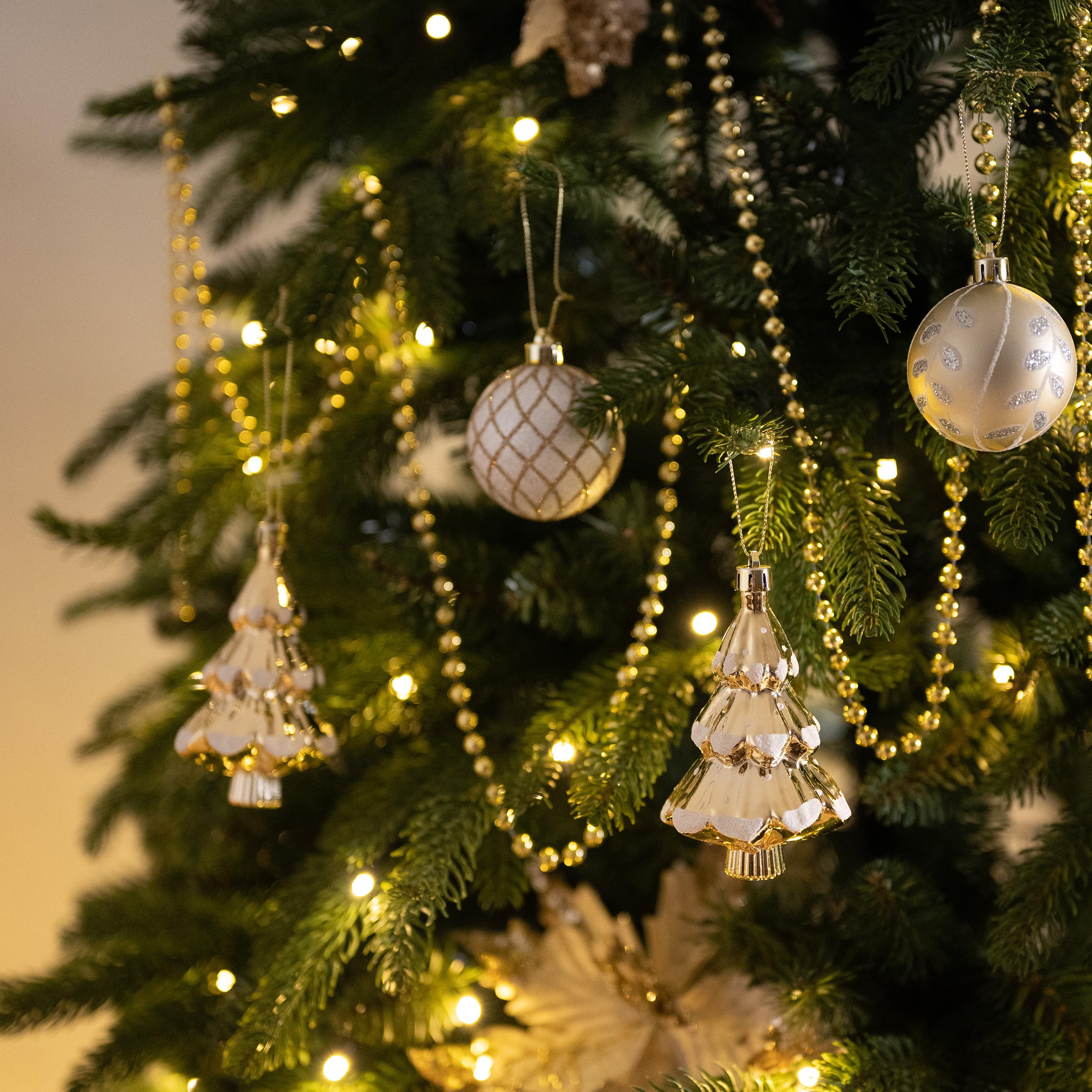 gold and white ornaments on Christmas tree