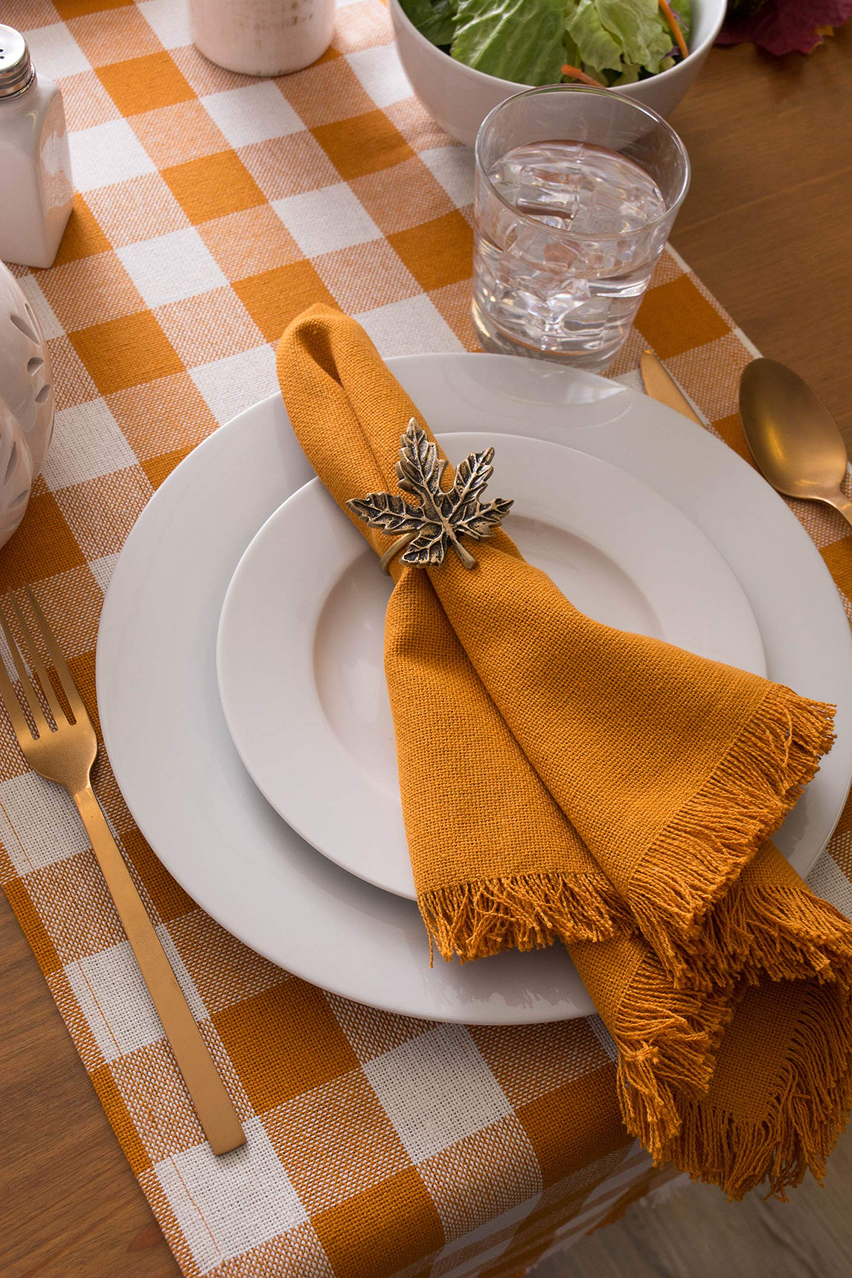 fall table decor ideas with orange checkered fall table runner and orange linen napkin with fringe, fall table setting
