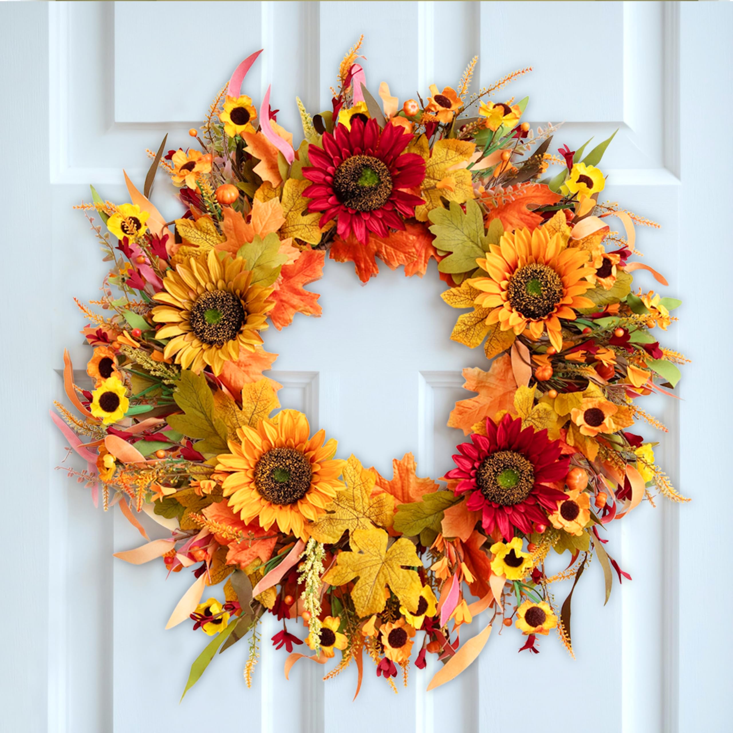 Autumn-themed wreath with sunflowers and fall leaves on a white font door.