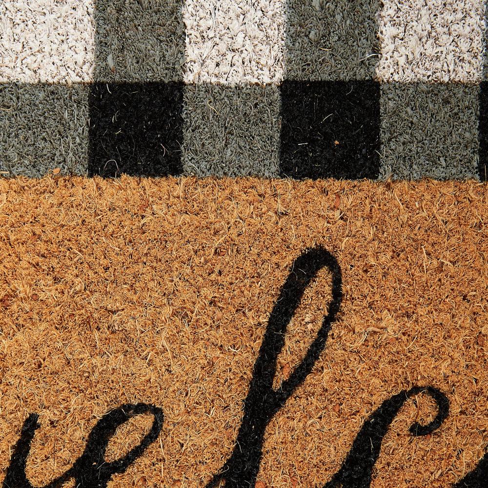 Black Checkered Welcome Mat Pattern Closeup