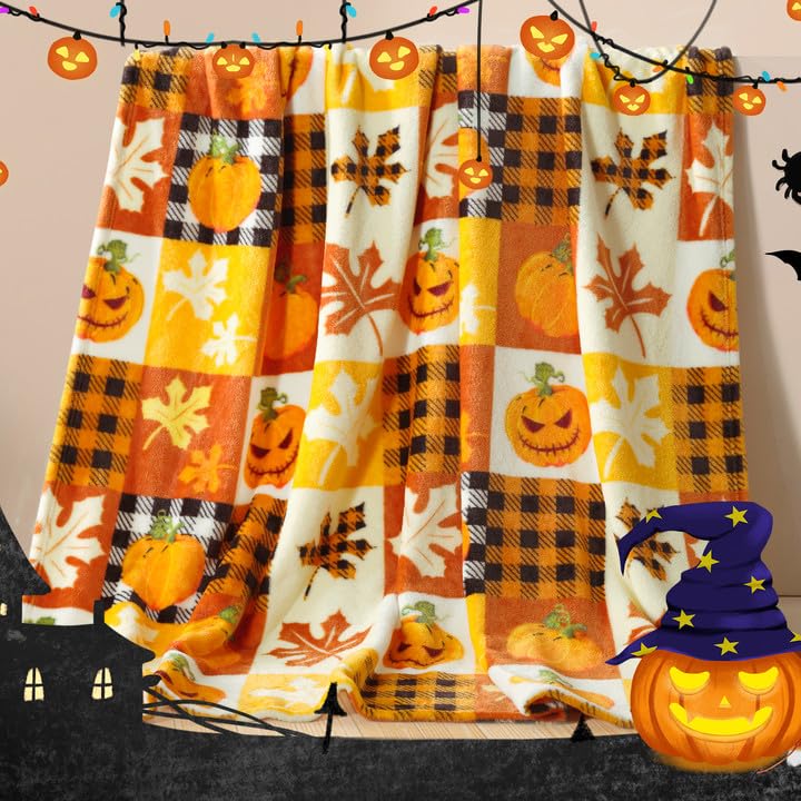 Halloween blanket with pumpkins and autumn leaves on a checkered pattern.