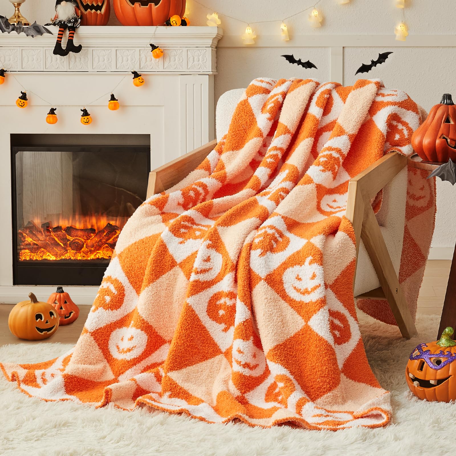 Halloween-themed blanket with pumpkins on a cozy living room floor with fireplace and decorations.