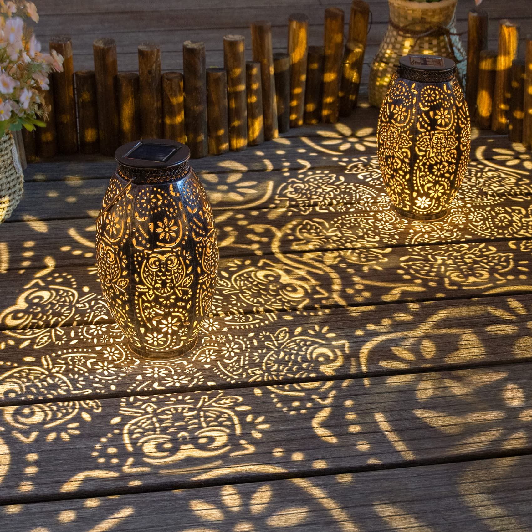 Decorative lanterns casting intricate patterns on a wooden surface