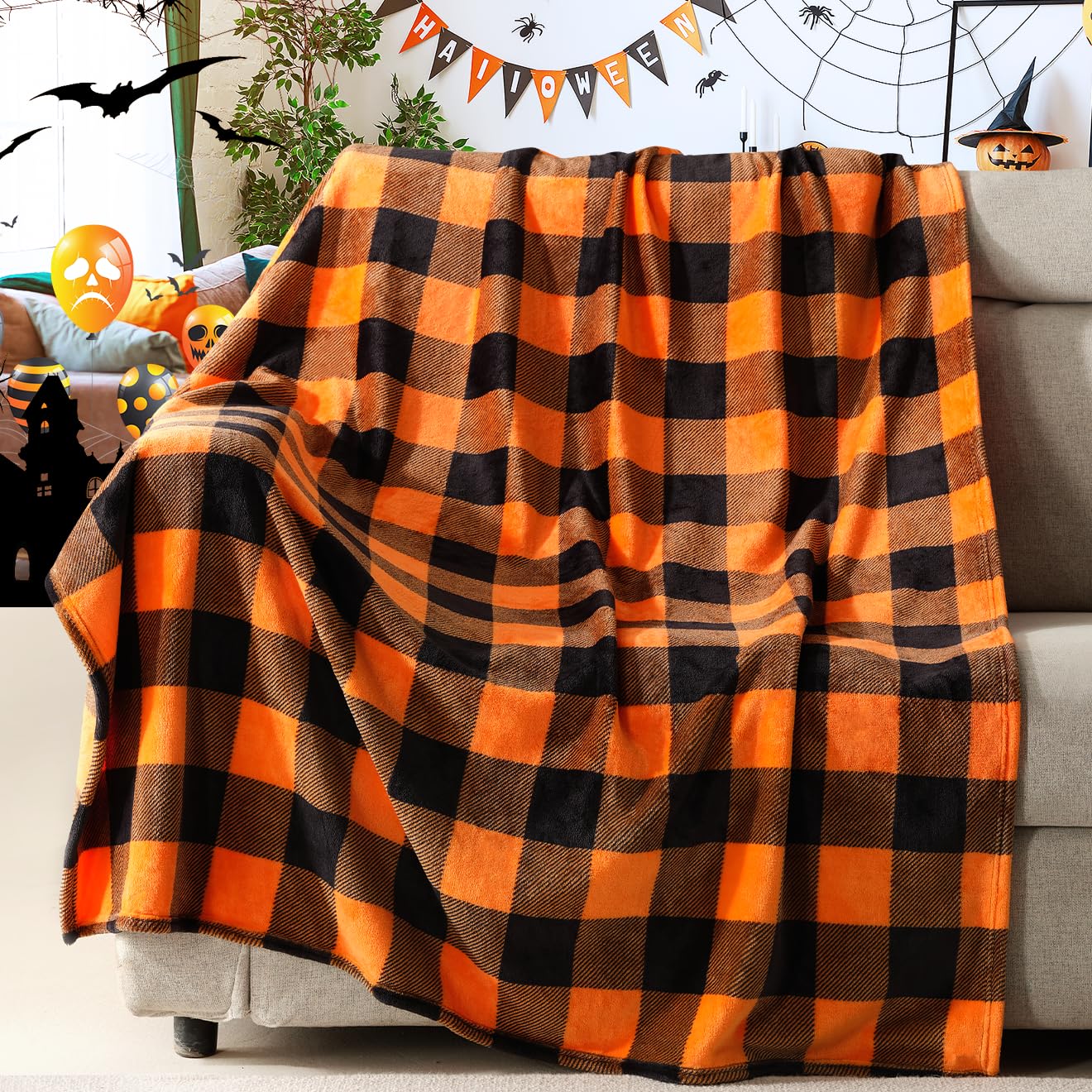 Orange and black checkered blanket draped over a couch with Halloween decorations in the background.