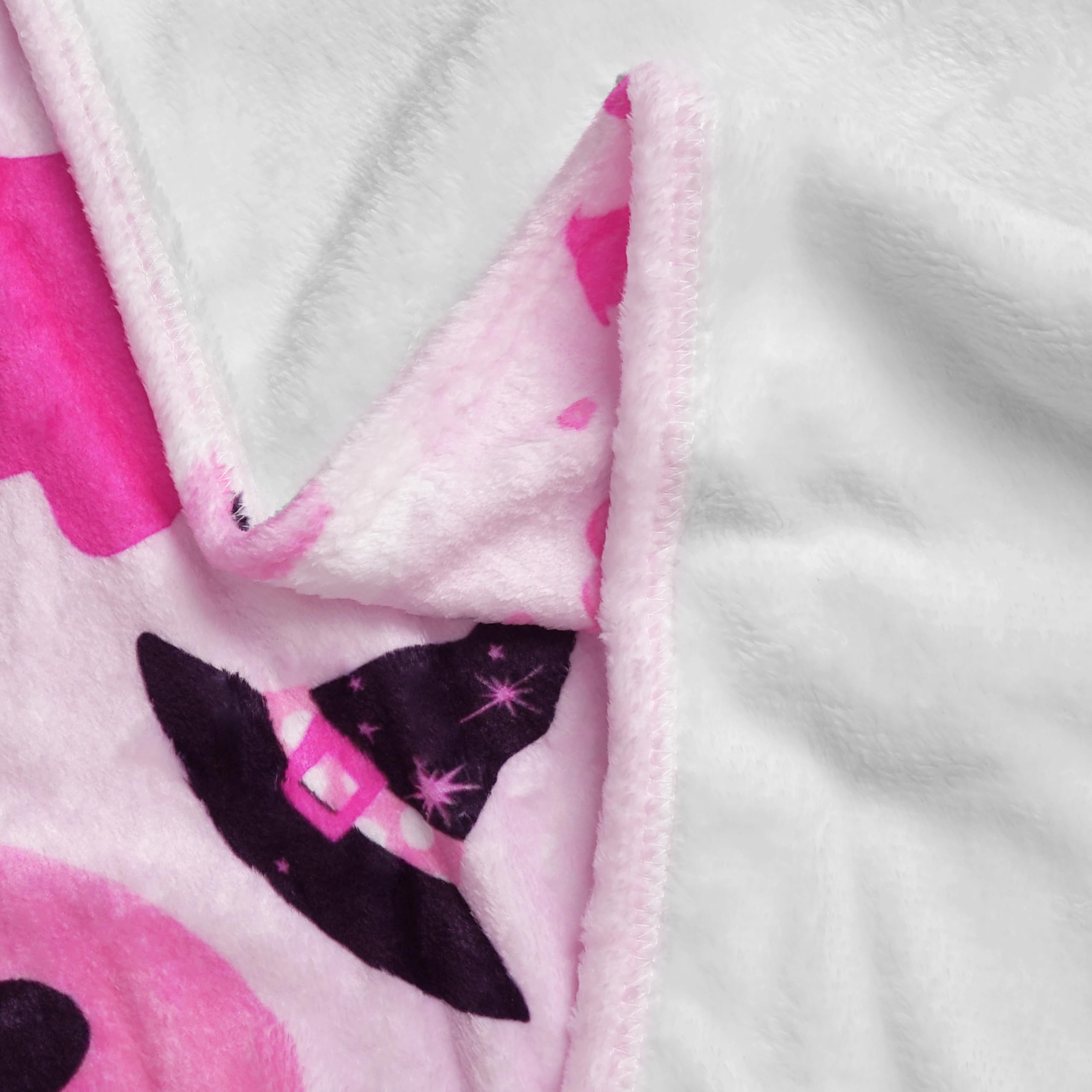 Close-up of a pink Halloween blanket