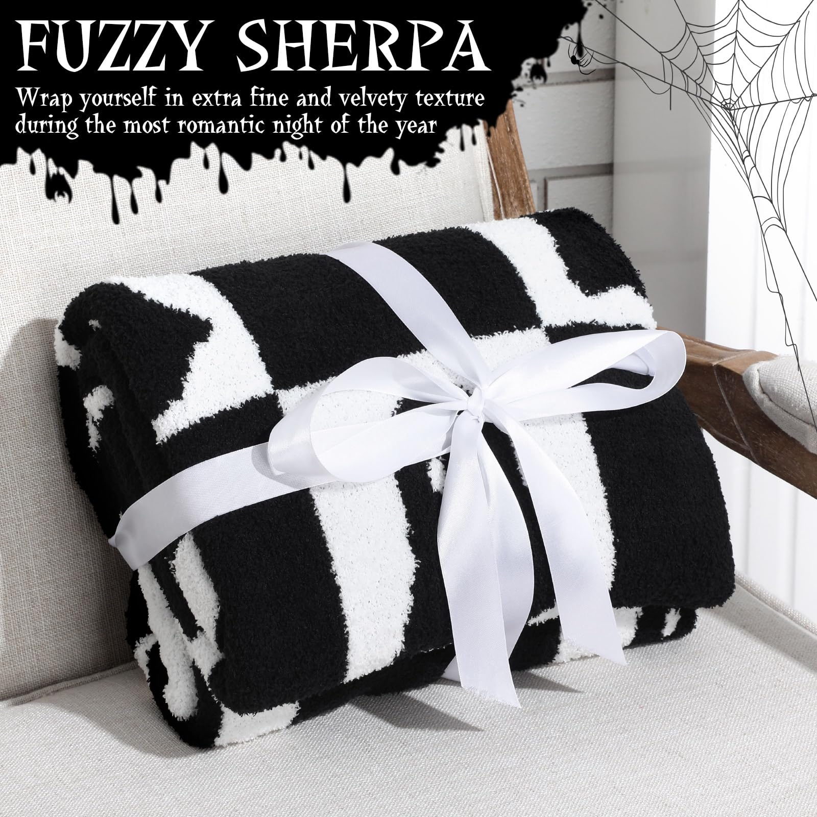 Black and white fuzzy sherpa checkered Halloween blanket with a white bow on a couch.