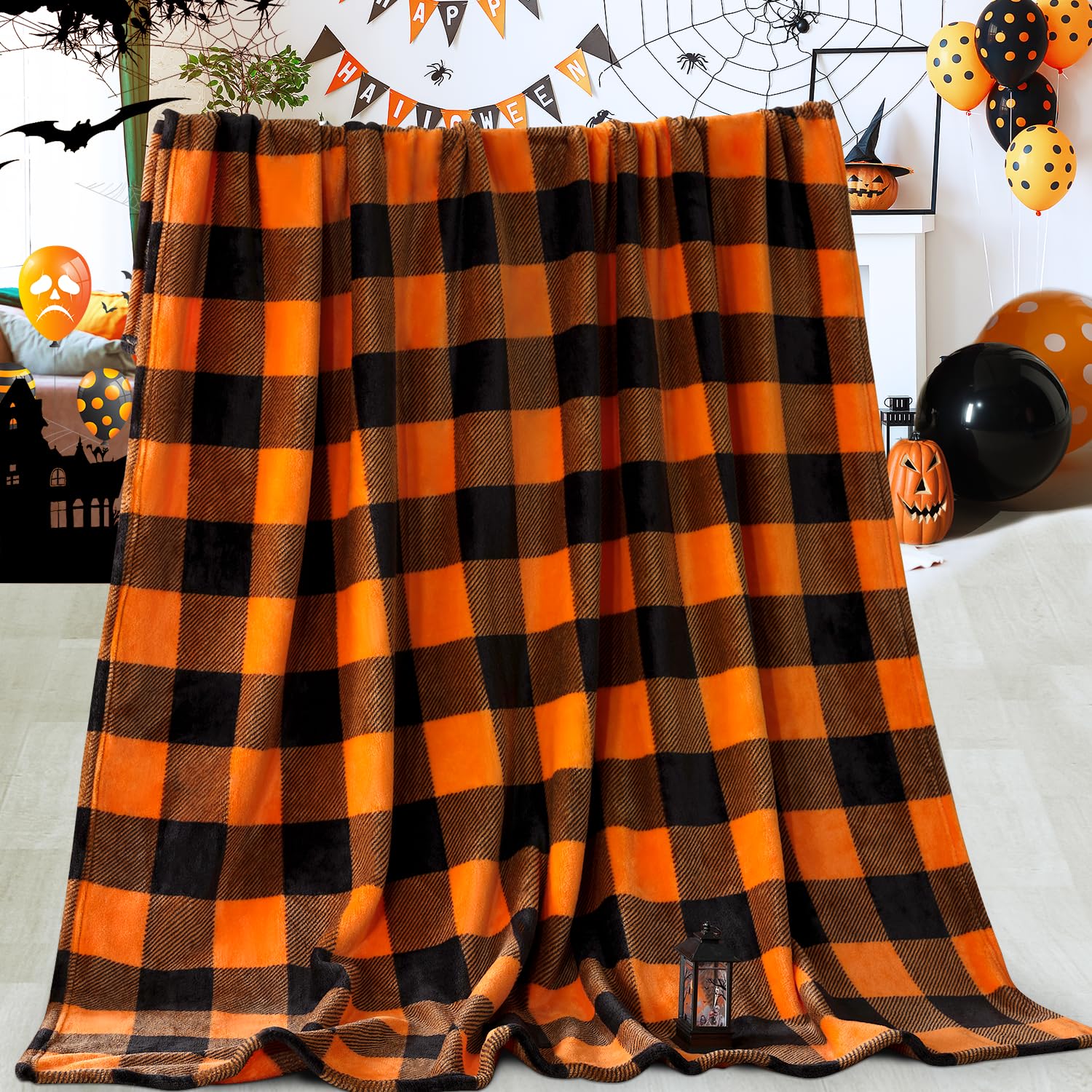 Orange and black checkered blanket draped over a surface with Halloween decorations in the background.