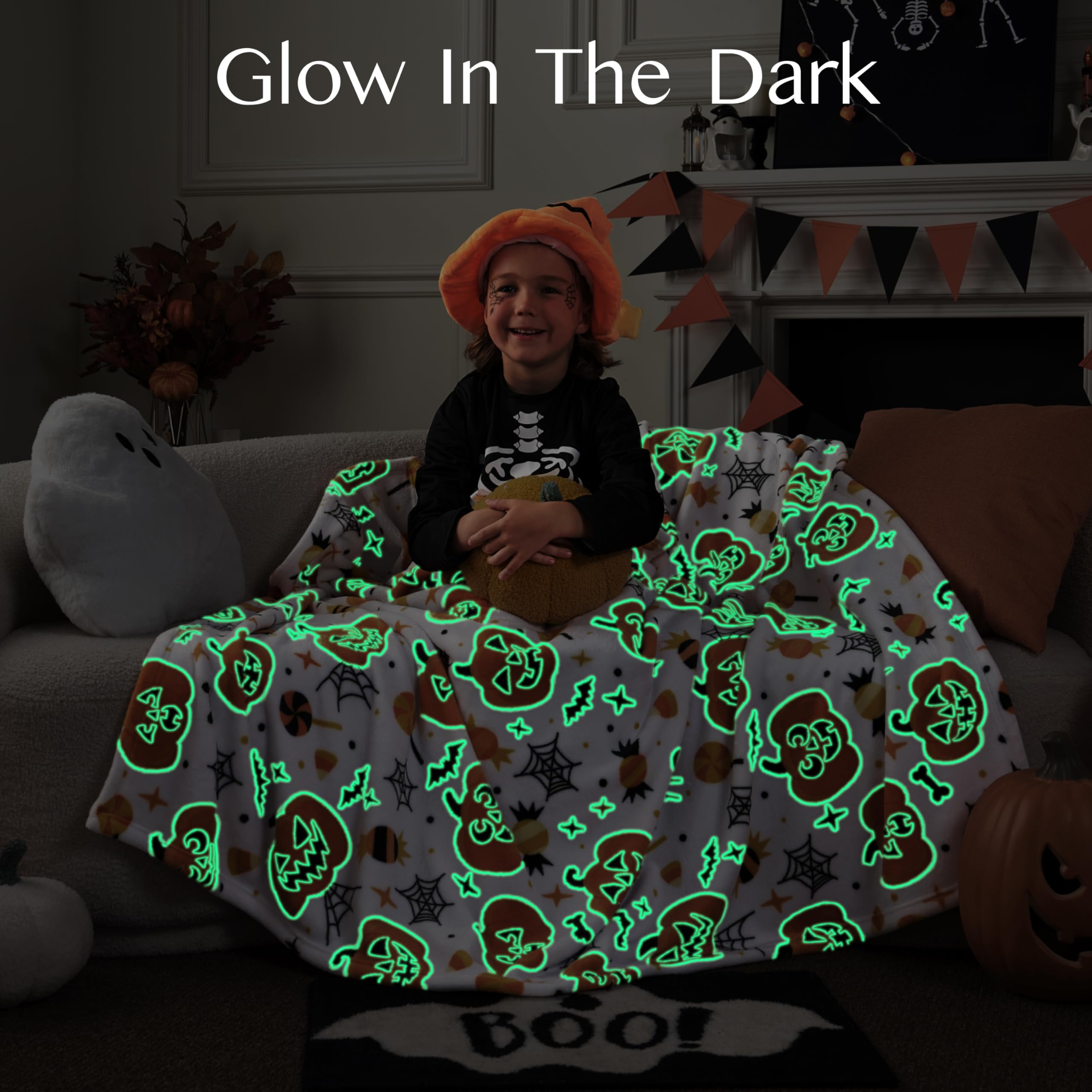 Person with Halloween-themed glow-in-the-dark blanket with green patterns.