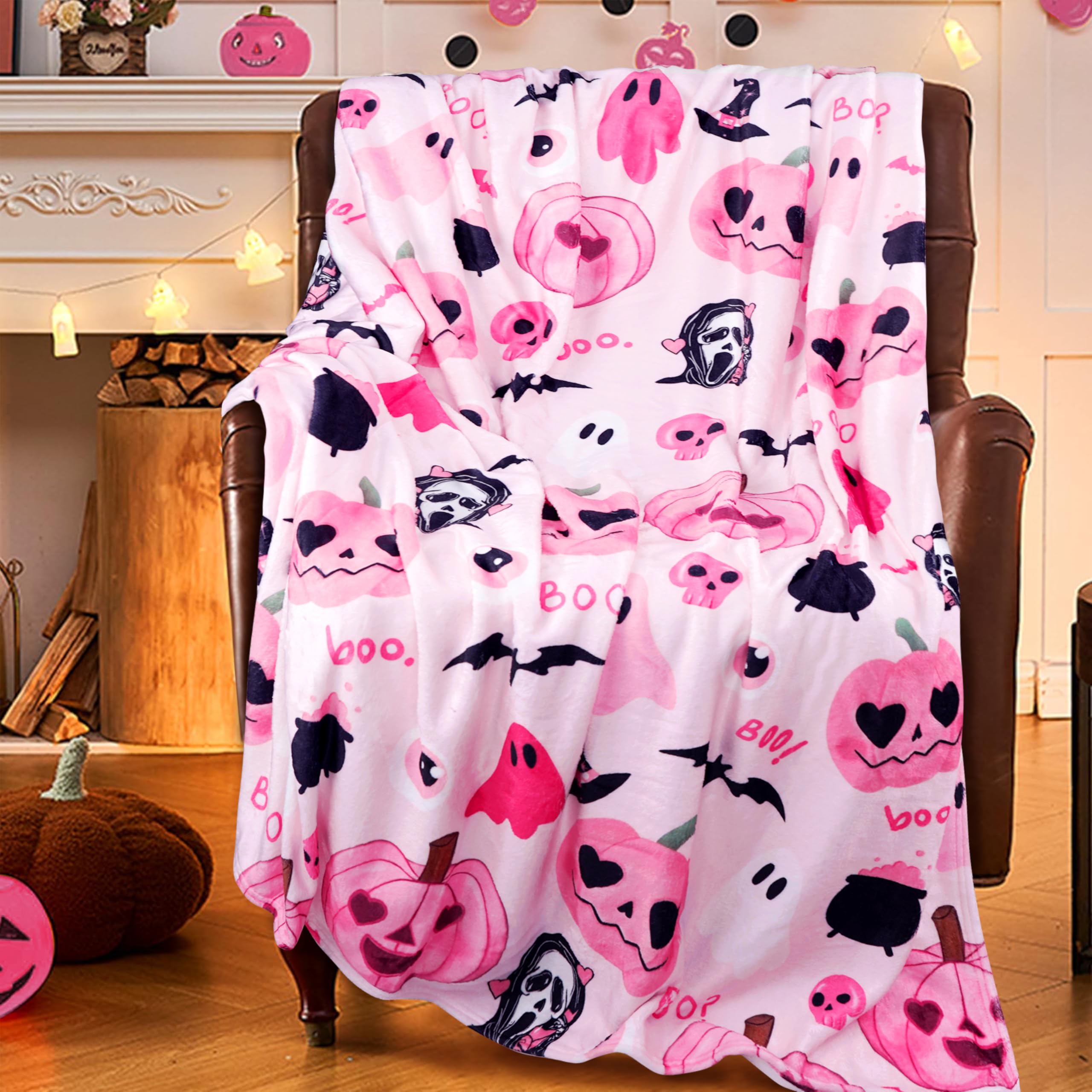 Pink Halloween-themed blanket draped over a chair in a cozy room with pumpkins.