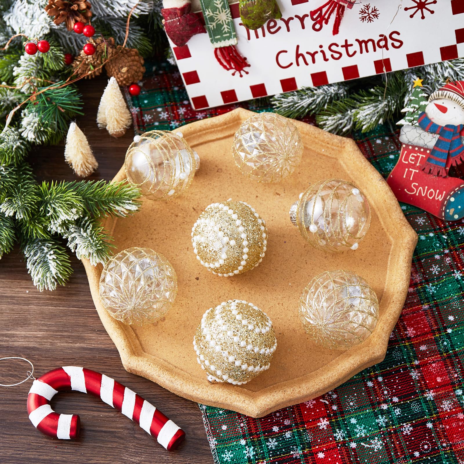 table decorated with Christmas decor and gold ornaments displayed